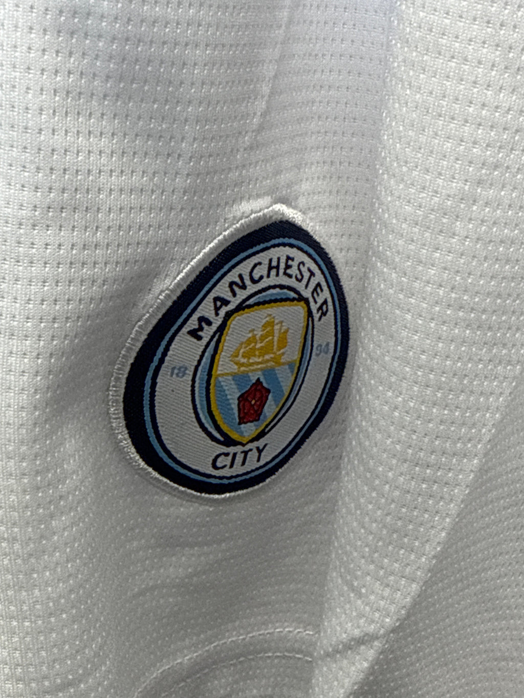 kitround Manchester City football shorts in white with the official club crest embroidered on the fabric
