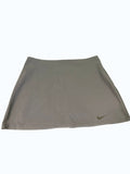 Navy Blue Nike Dri-FIT Tennis Skirt with subtle swoosh logo on hem. Lightweight, breathable, and moisture-wicking fabric.