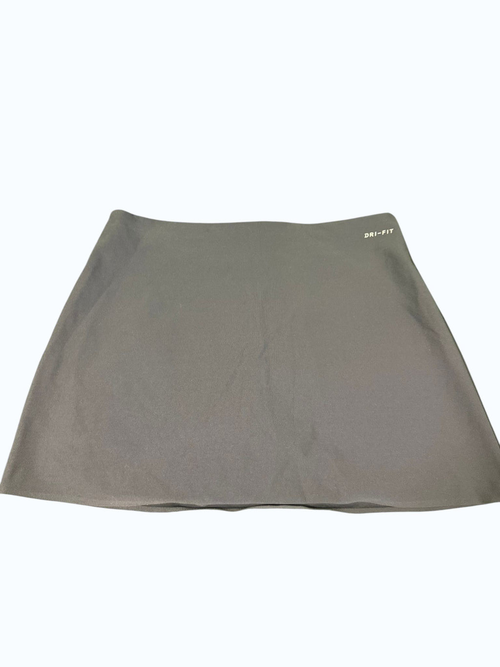 Navy Blue Nike Dri-FIT Tennis Skirt with a subtle swoosh logo on the hem. Lightweight, breathable, and moisture-wicking fabric.