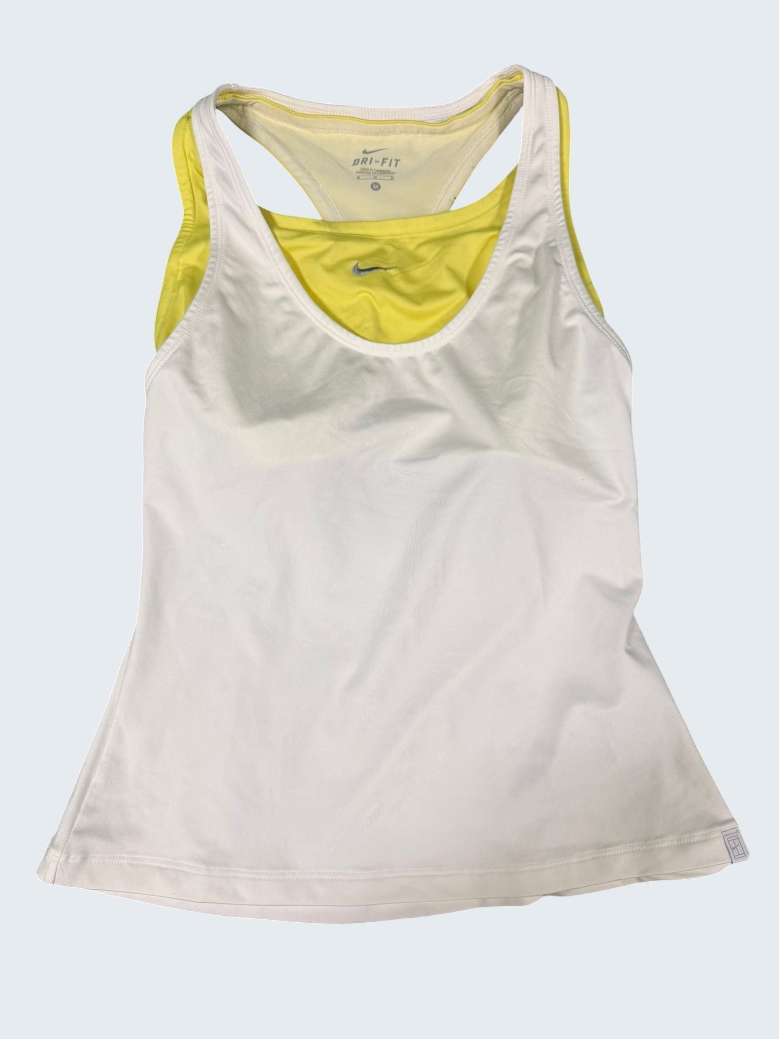 Nike Dri-FIT white tennis vest top with yellow inner layer and racerback design. Medium size.