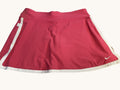 kitround Nike pink tennis skirt with white trim and swoosh logo, lightweight and breathable fabric for comfort and movement.