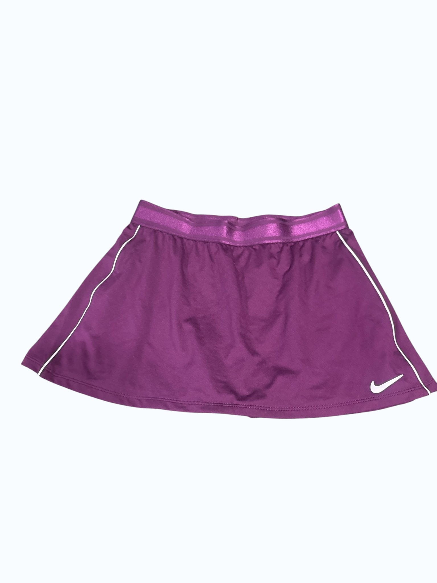 Nike women's purple tennis skirt with white trim and logo, ideal for performance and comfort on the court.
