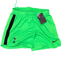 Nike Women's Tottenham Hotspur bright green football shorts with black side stripe, crest, and swoosh. Elastic waistband.