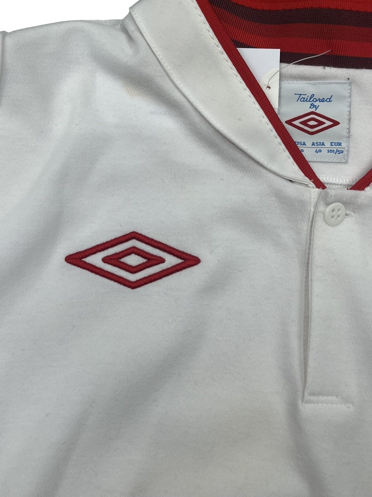 kitround vintage white Umbro England football shirt with red collar trim and embroidered logo, size EU 40