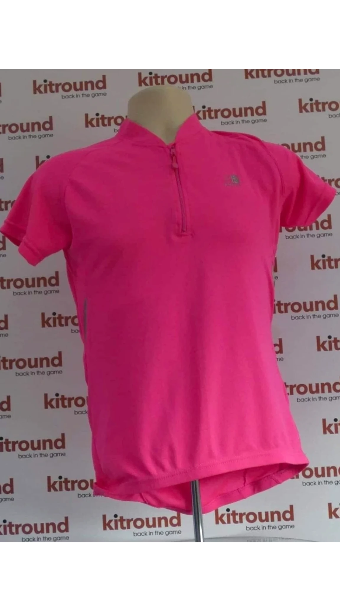 kitround women's bright pink short-sleeved cycling jersey with short zip and three back pockets.