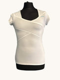 kitround Women's white HEAD tennis top with short sleeves and a V-neck, featuring mesh panels and diagonal seam details.