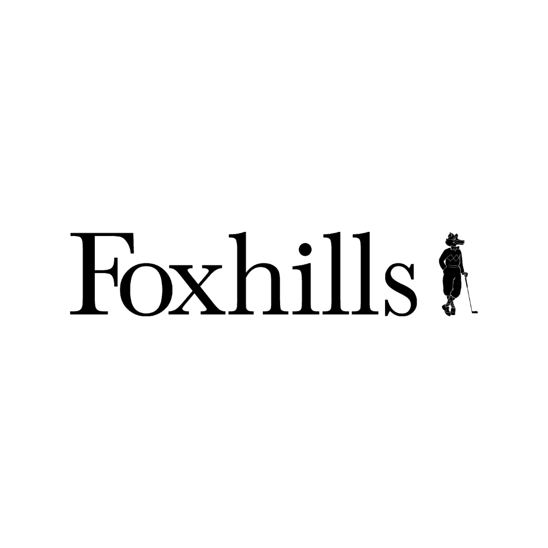 Logo of Foxhills with a silhouette of a person holding a dog on a white background