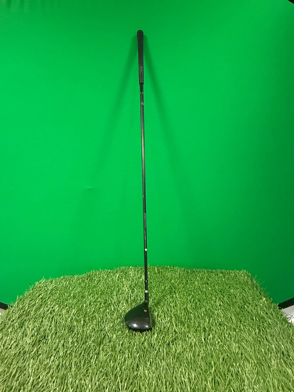 MacGregor oversize 5 wood golf club standing upright on artificial grass with green background