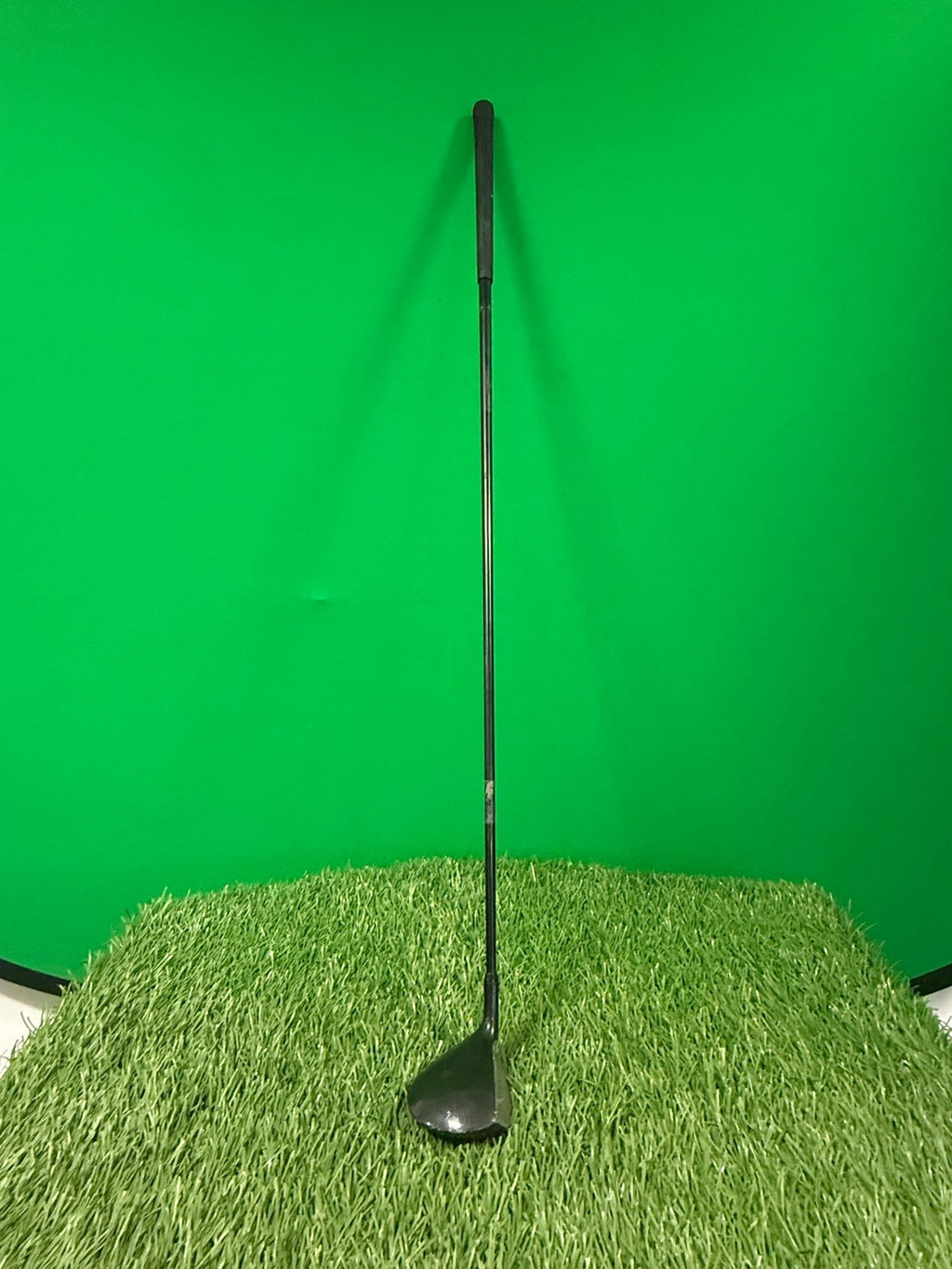 MacGregor Oversize MC400 7 wood golf club standing on artificial grass with a green background
