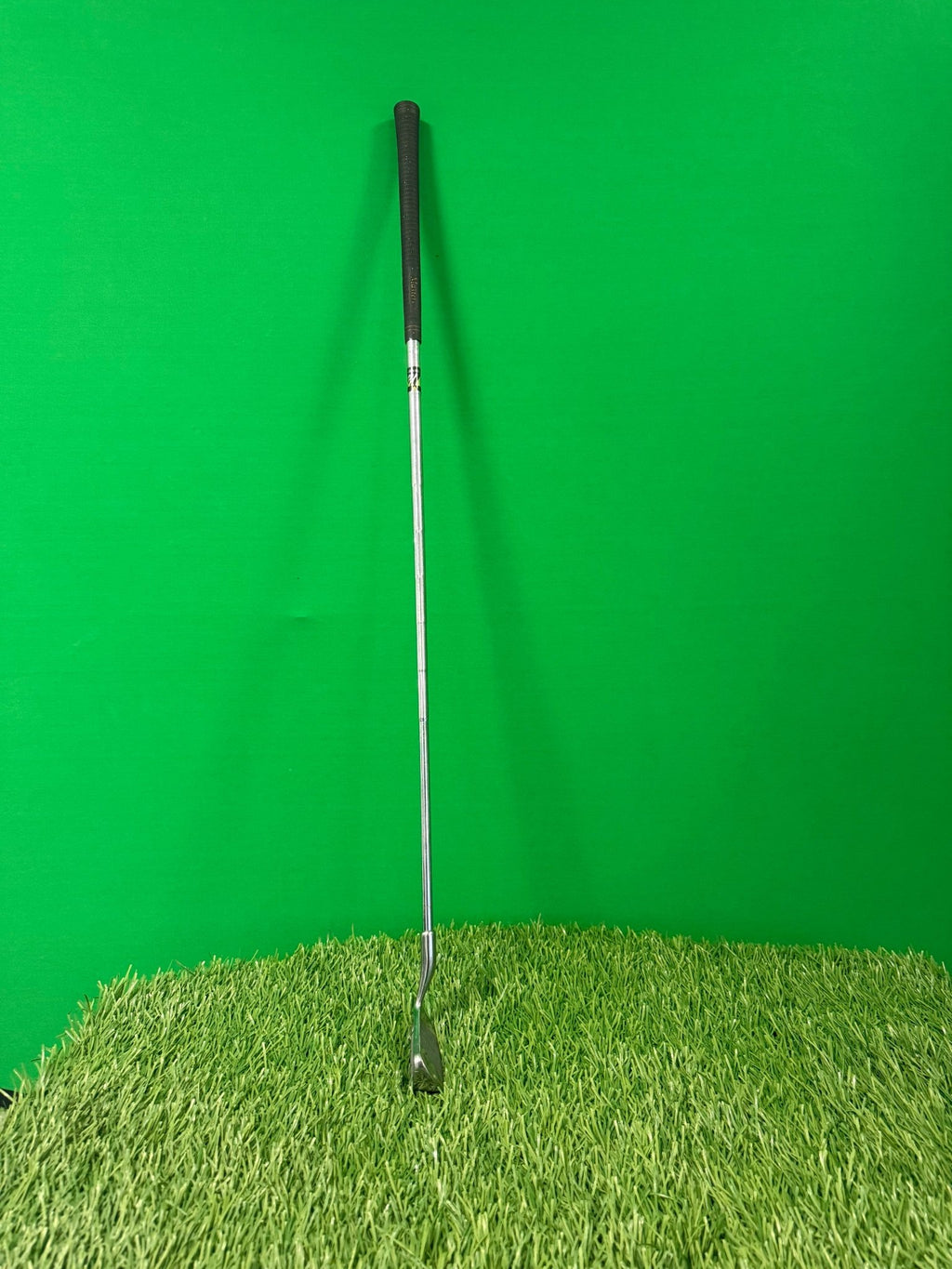 Mascherchip 3 chipper golf club standing on artificial grass with green background