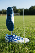Pair of men's adidas white and blue astro turf football boots with textured blue sole and adidas branding