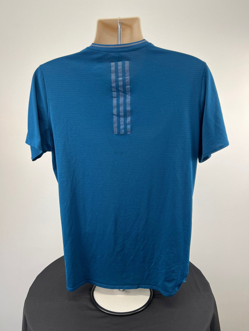 Back view of blue adidas Climacool running t-shirt with three stripes detail
