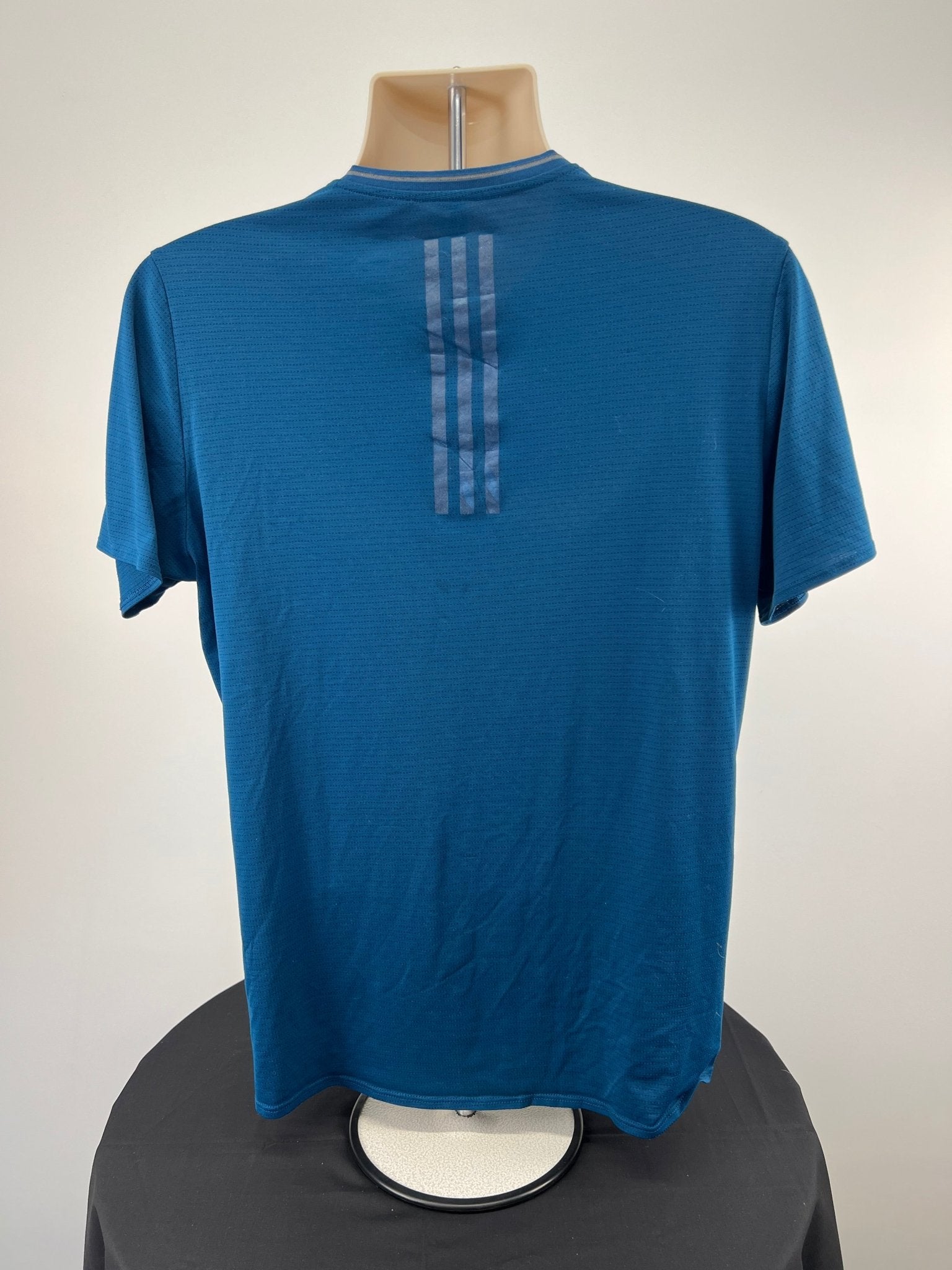 Back view of blue adidas Climacool running t-shirt with three stripes detail