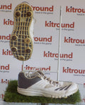 Pair of adidas white and grey cricket spikes showing upper and sole with six metal spikes