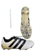 White and black Adidas football boots with changeable metal studs