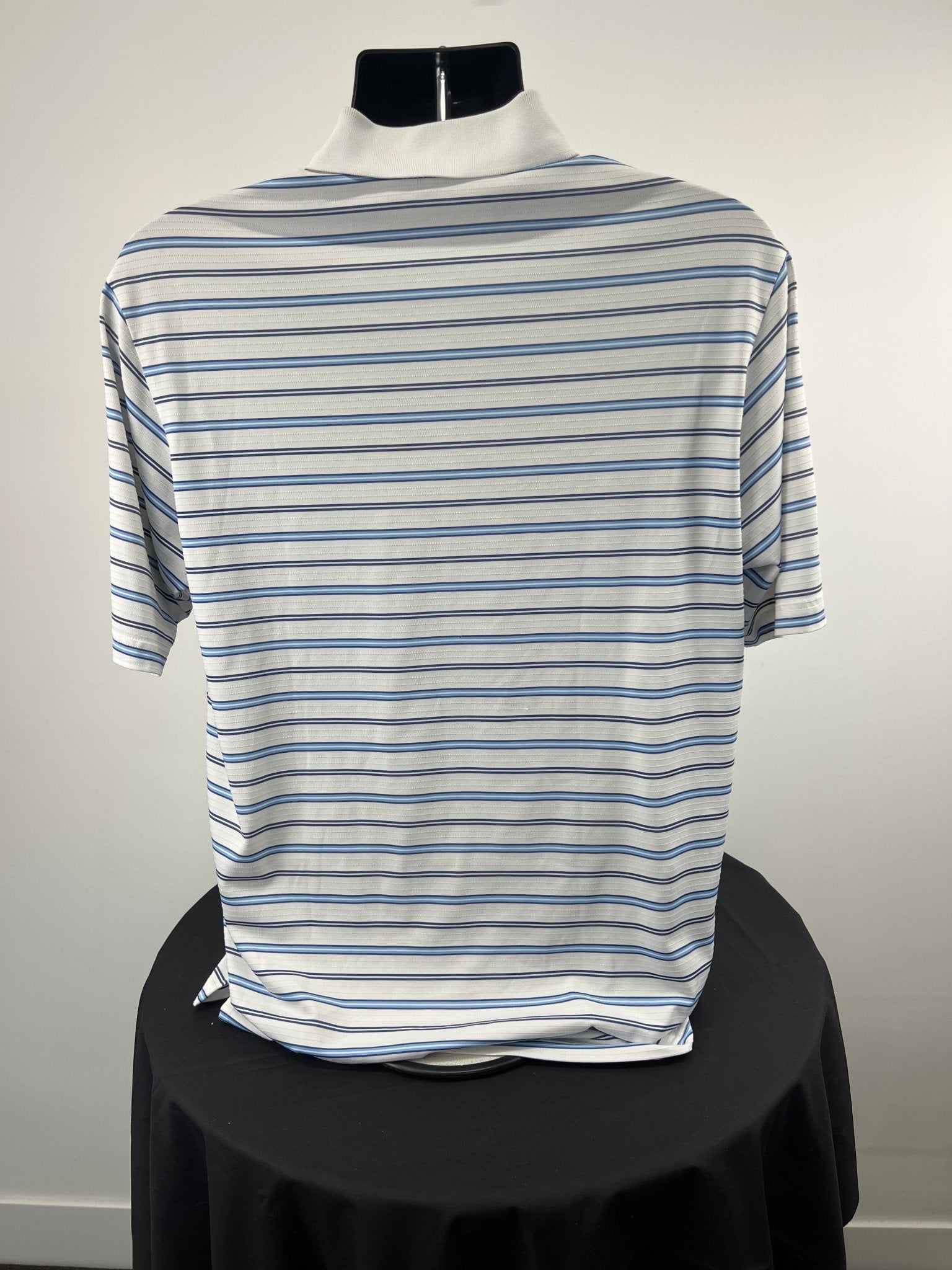 Back of men's adidas golf polo shirt with blue and white stripes