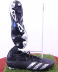adidas Predator Demonscale black football boots with white details, showing sole and side profile