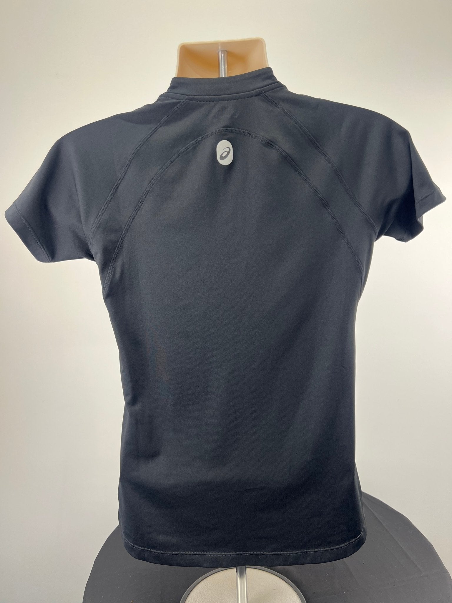 Back view of men's black ASICS running top with reflective logo