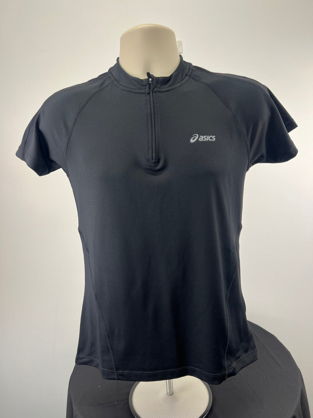 Front view of men's black ASICS running top with zip in size M