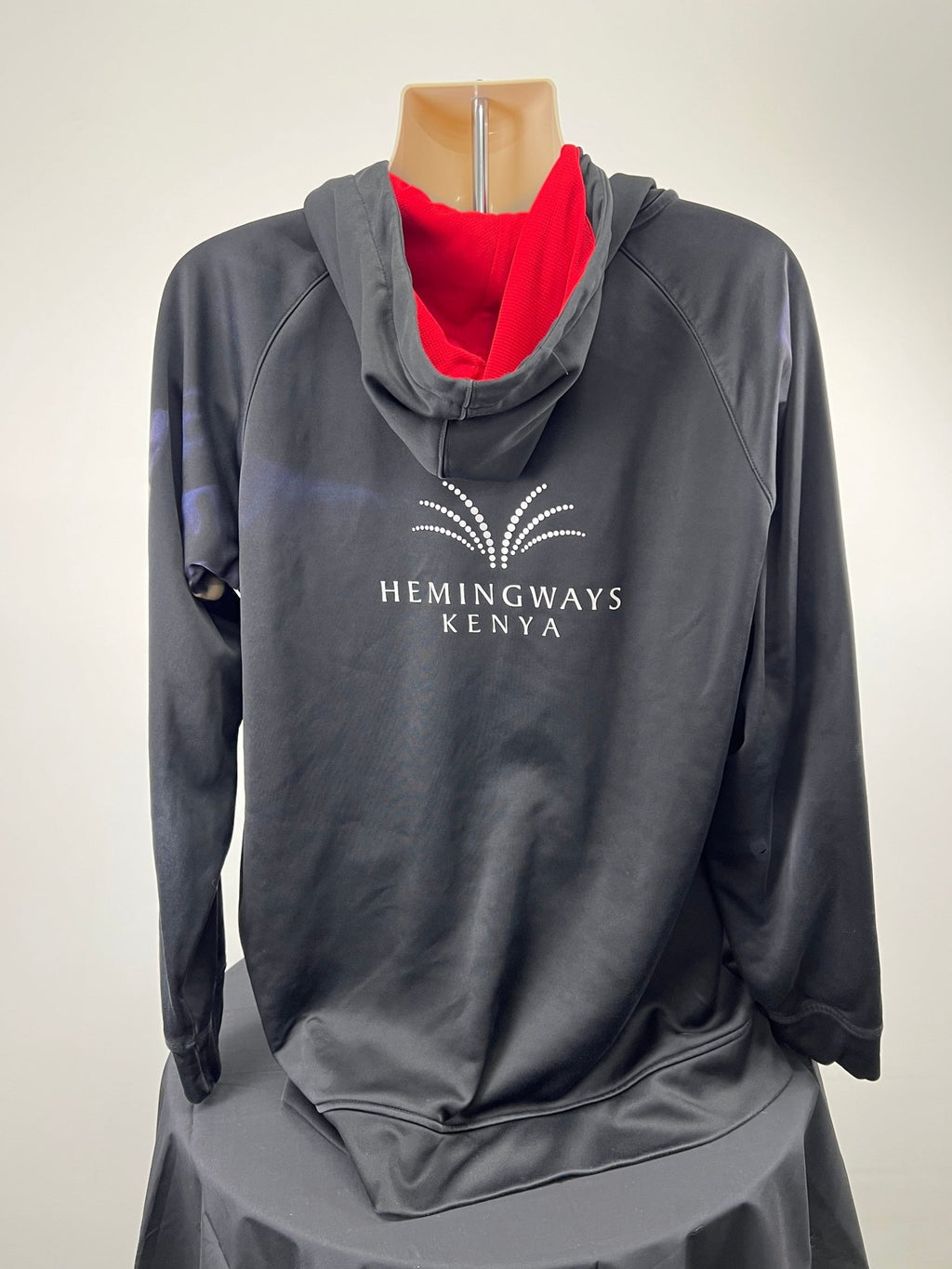 Rear view of the hoodie showing Hemingways Kenya branding and red hood lining