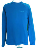 Front view of blue Craft men's jumper with dot pattern ventilation on sleeves, displayed on mannequin