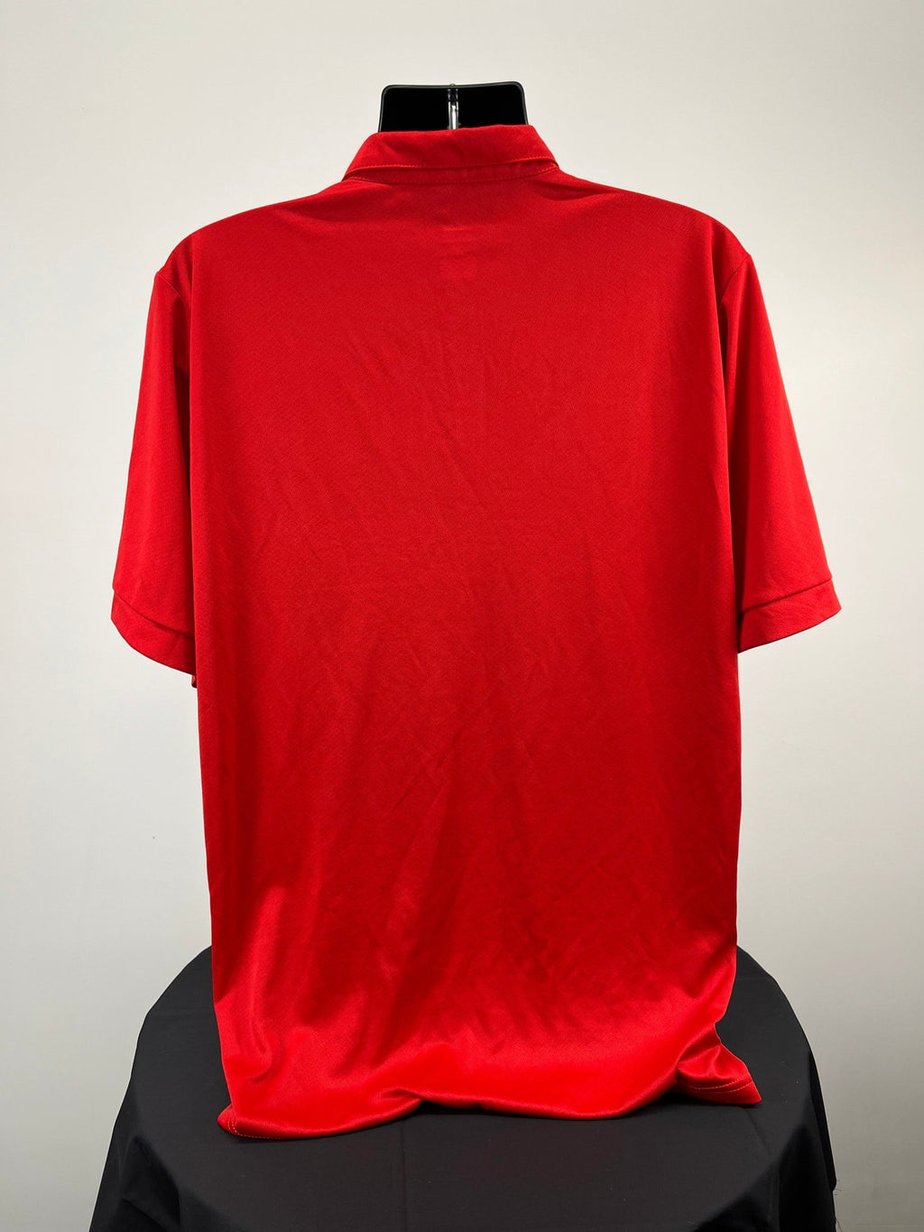 Back view of men’s red England volleyball polo shirt showing plain red design