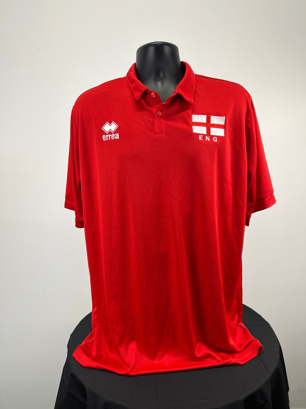 Front view of men’s red England volleyball polo shirt with Erreà logo and England flag emblem