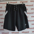 Black Gymshark sports shorts with white side panels shown hanging