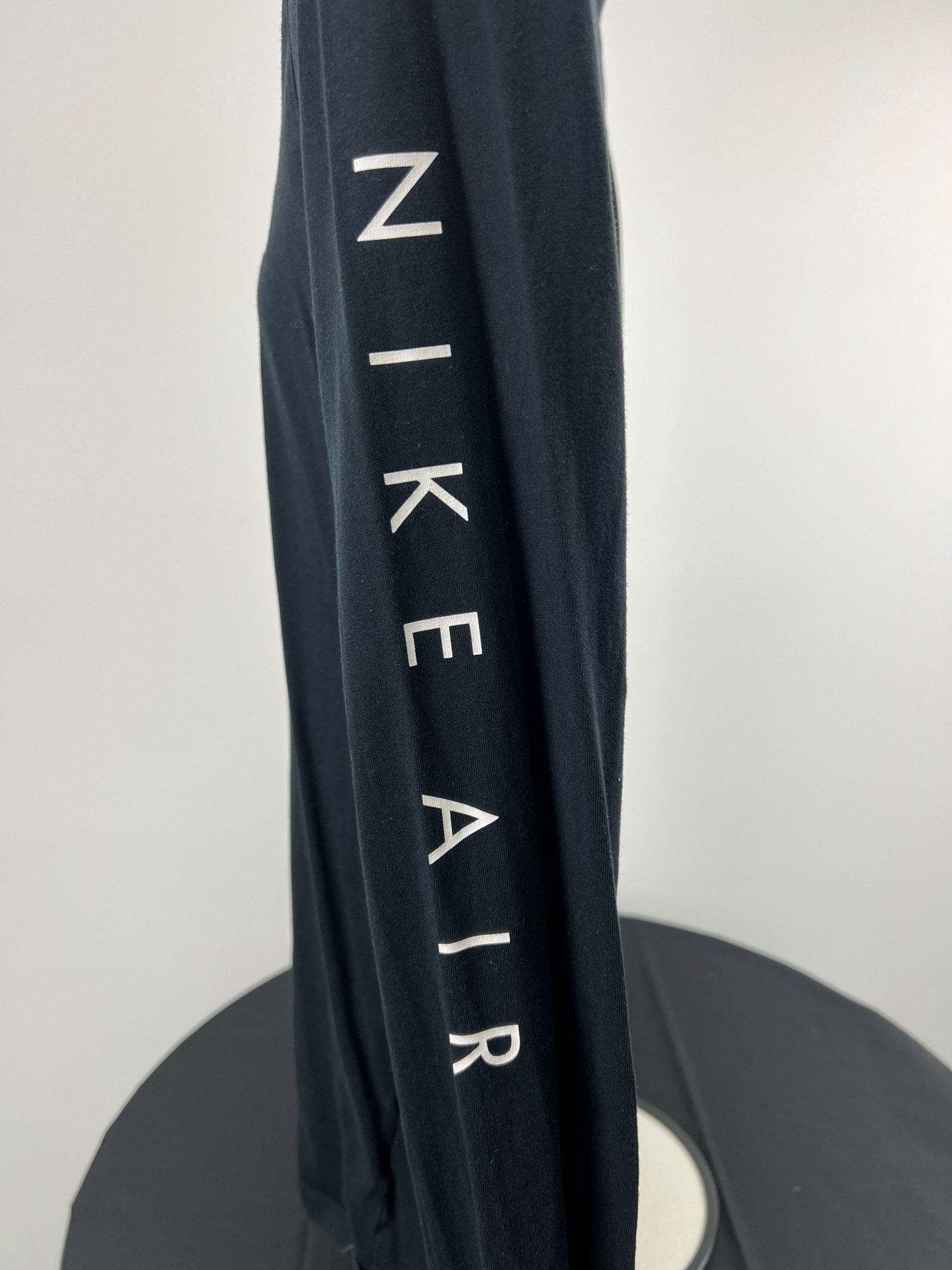 Close-up of sleeve featuring Nike Air text