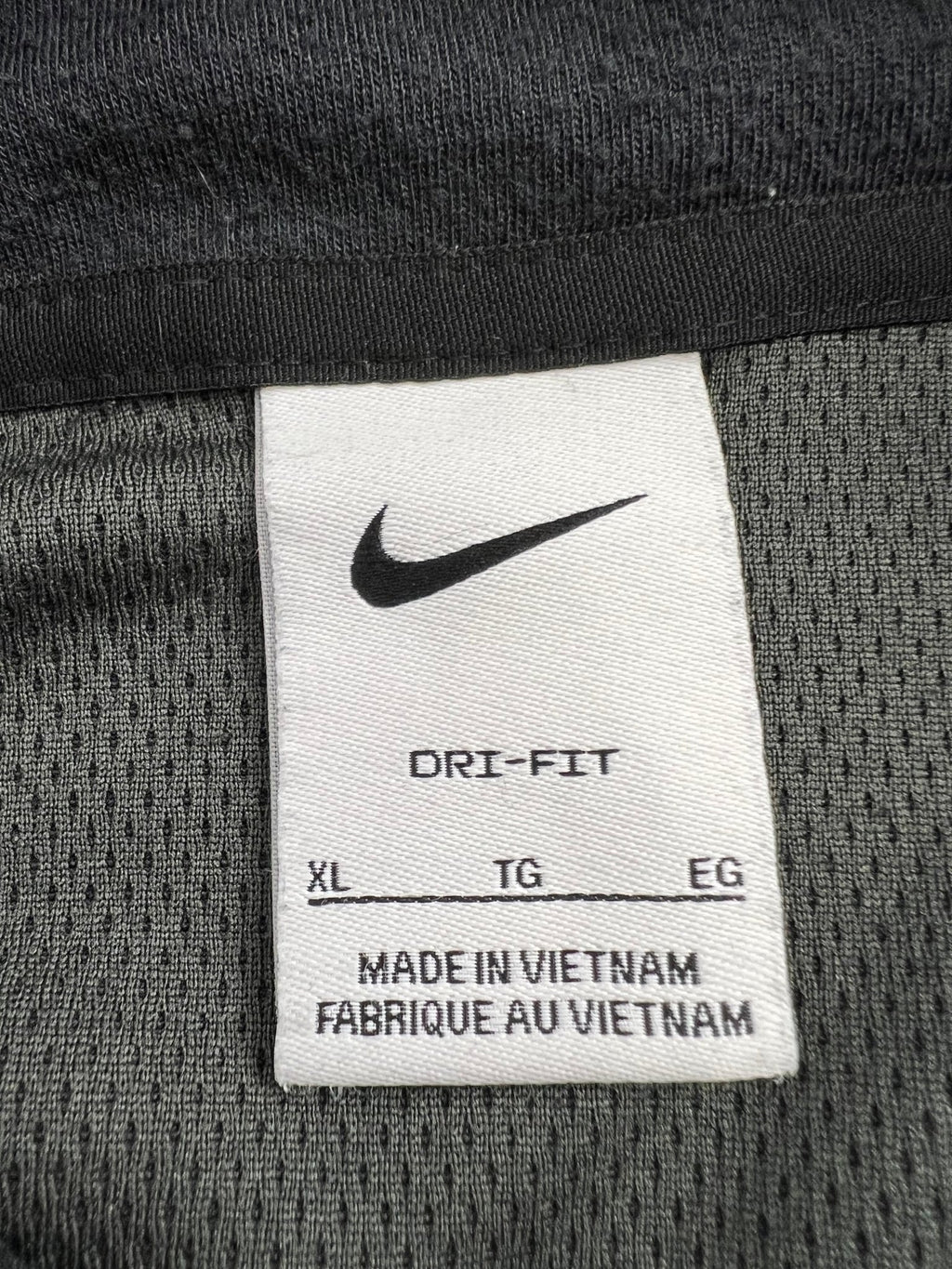 Close-up of Nike Dri-FIT XL label inside the top