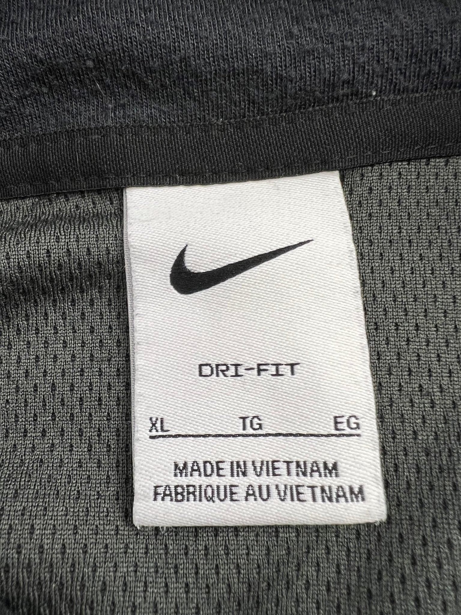 Close-up of Nike Dri-FIT XL label inside the top