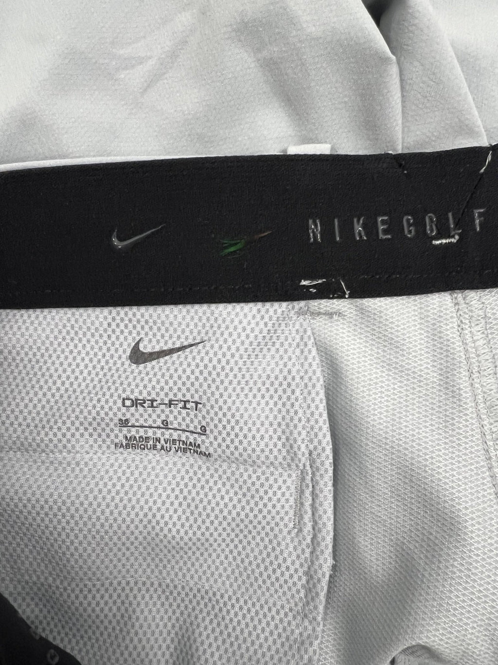 Close-up of interior waistband and Dri-FIT label inside Nike golf shorts