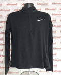 Front view of black Nike Dri-FIT 1/2 zip long sleeve sports top with white swoosh logo