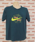 Front of Nike Dri-FIT teal sports top with yellow swoosh and graphic