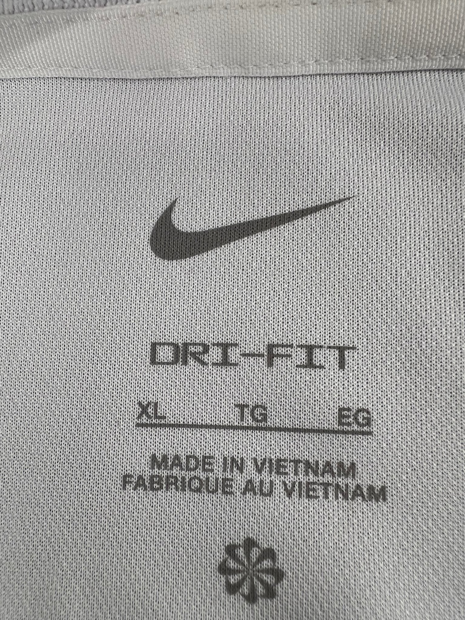 Close-up of Nike Dri-FIT tag inside the polo shirt