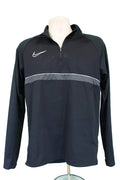 Front view of black Nike Dri-Fit 1/4 zip top with white swoosh and grey stripe
