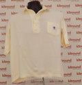 Front view of a white GM cricket polo shirt with chest pocket
