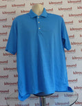 Front view of Adidas blue golf polo shirt displayed on mannequin