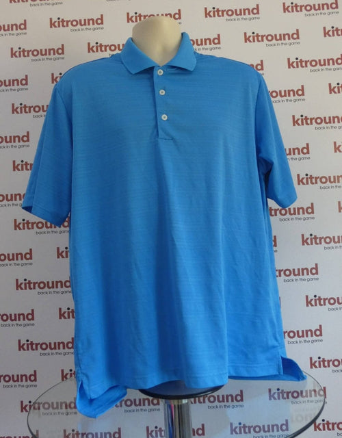 Front view of Adidas blue golf polo shirt displayed on mannequin