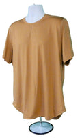 Men's Puma brown sports top displayed on mannequin against green backdrop