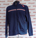 Saucony navy track jacket with white and red stripes displayed on mannequin