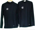 Two black Sondico long sleeve sports base layer tops on hangers