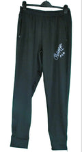 Nike black Dri-FIT sports trousers with zip leg and logo, laid flat