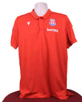 Front view of Macron Stoke City FC red polo shirt with club crest and sponsor logo
