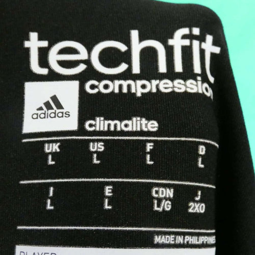 Adidas TechFit Climalite shirt inner label showing size L and brand details