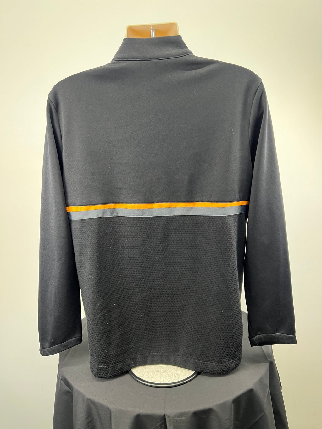 Back view of black Umbro jacket showing orange and grey stripe, size L