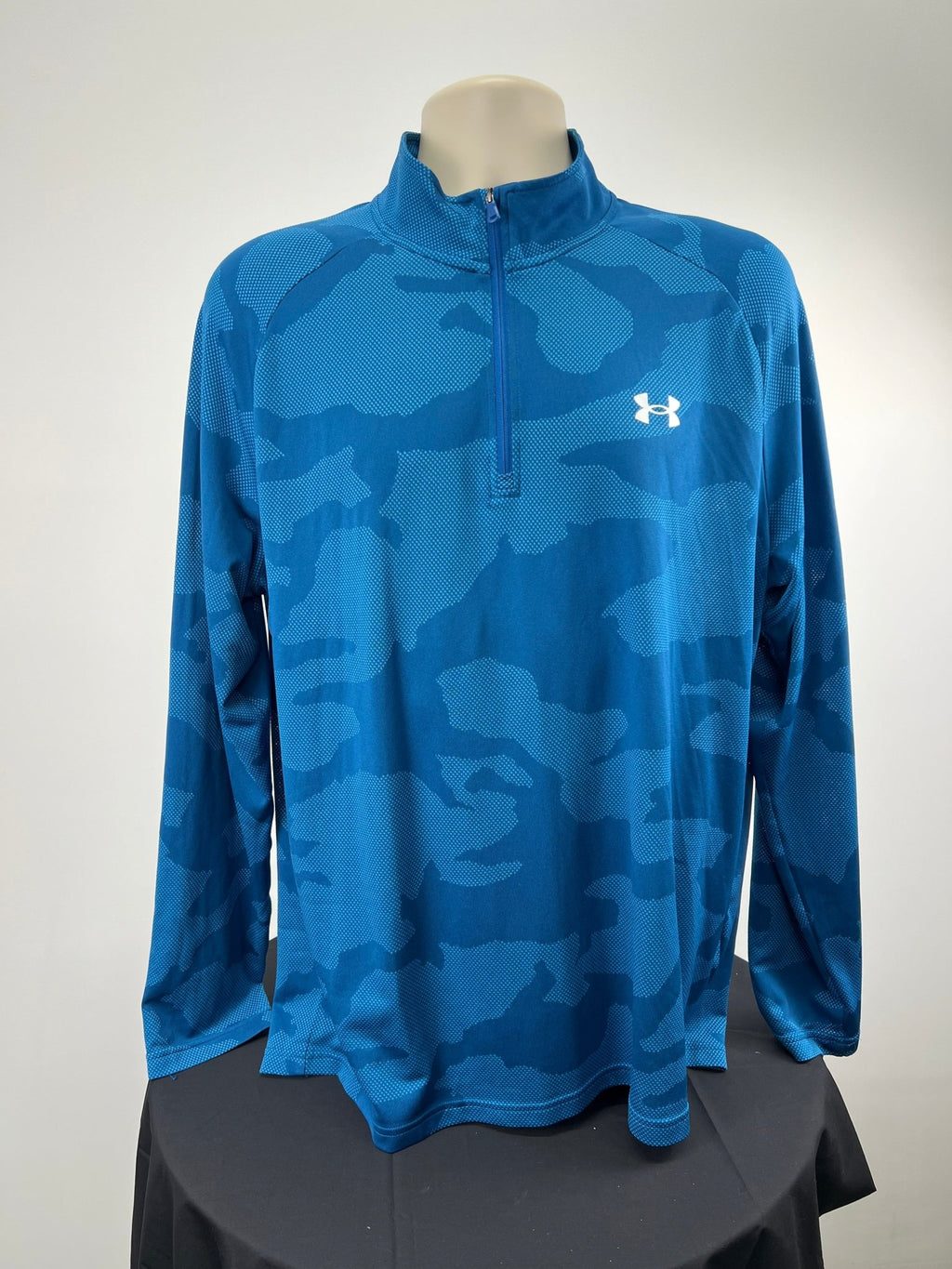 Front view of blue Under Armour 1/4 zip top in XL with camo pattern
