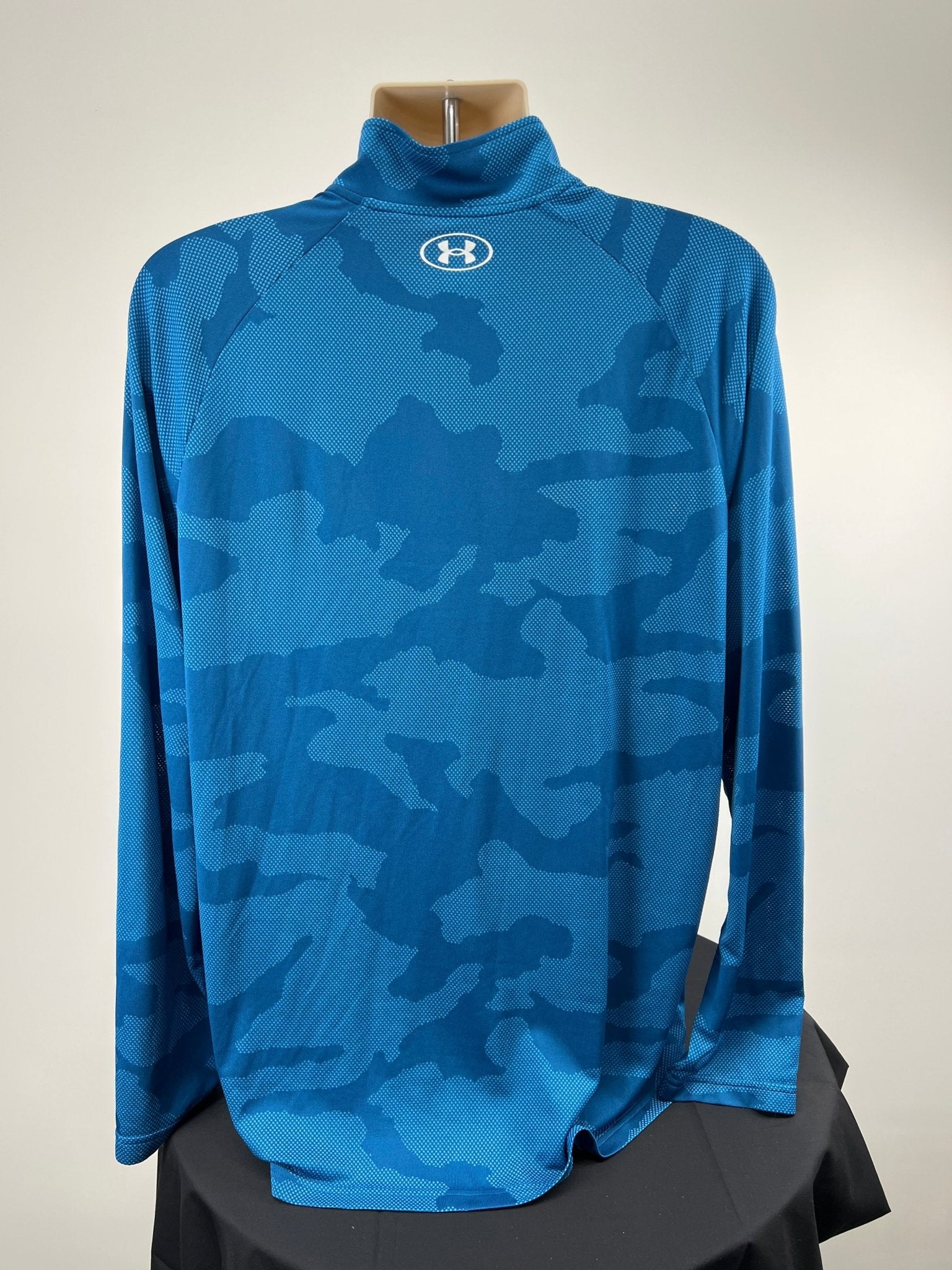 Back view of blue Under Armour 1/4 zip top in XL with Under Armour logo on collar