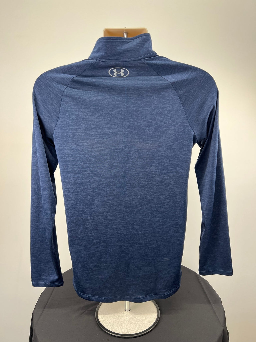 Back view of men's dark blue Under Armour 1/2 zip loose fit top size S