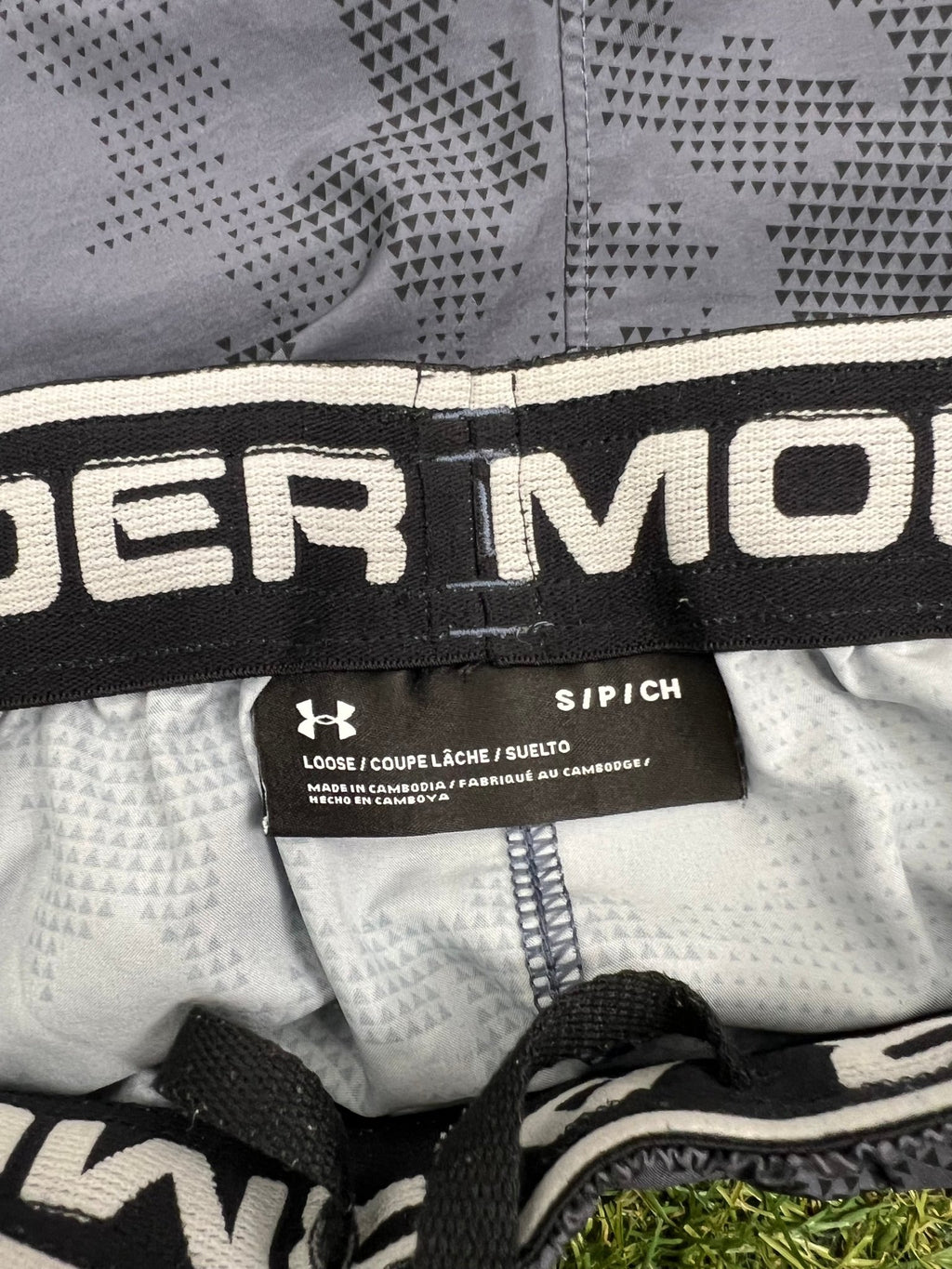 Close-up of waistband and label on men's Under Armour loose fit shorts